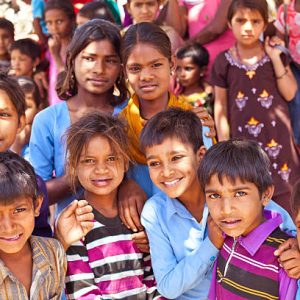 Sabbalpura, India - March 15, 2014: Group of happy indian school children posing in the rural village, Rajasthan, India.